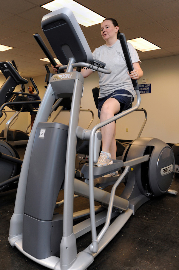 A woman working out on an elliptical