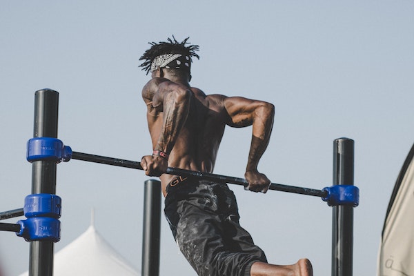 Man doing gymnastics at the park