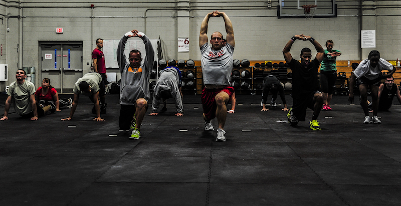 Men and women completing a CrossFit WOD