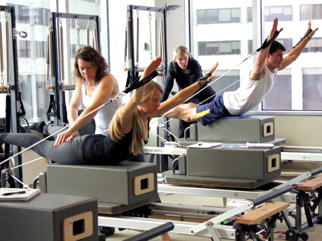 Women in a pilates class with instructor