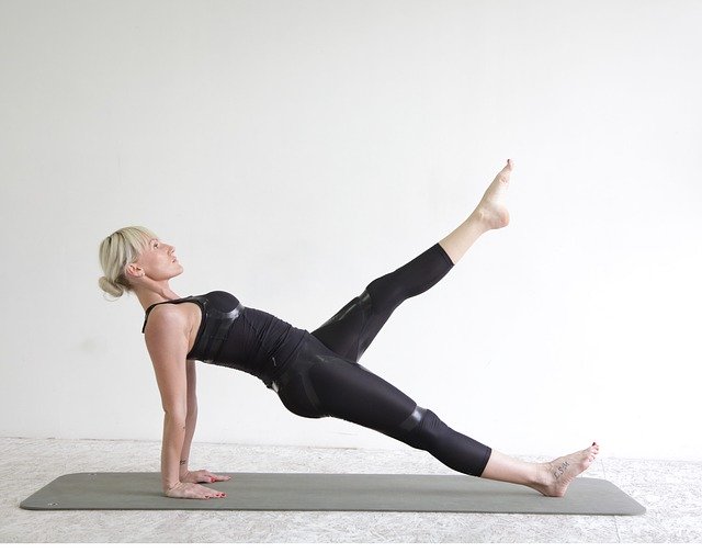 Woman doing pilates on mat