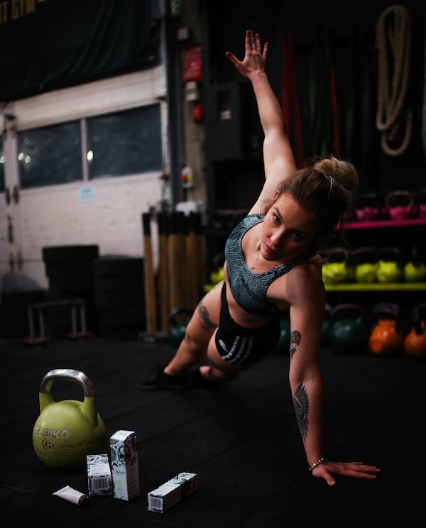 Woman doing HIIT workout at gym