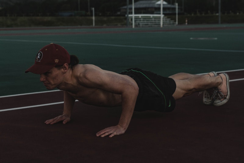 A man doing pushups outside