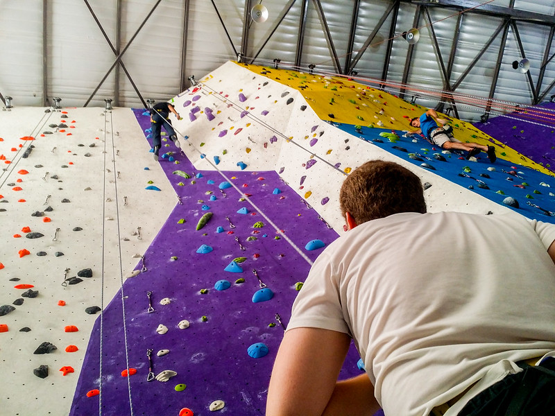 Man climbing rock wall