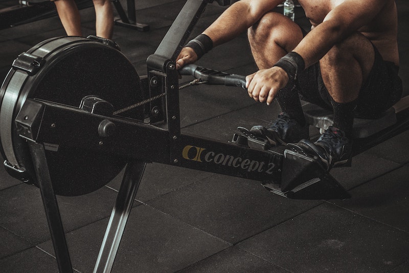 Man on concept 2 rowing machine