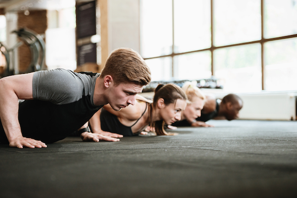 Group doing planks in yoga class